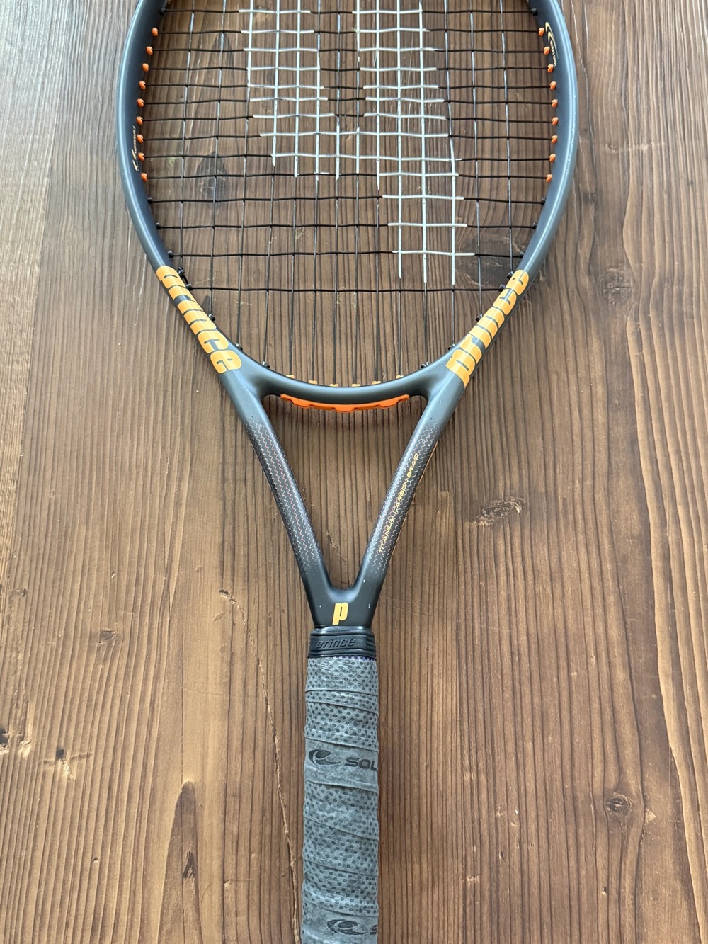 Prince Tennis Racket in Black and Orange Accent